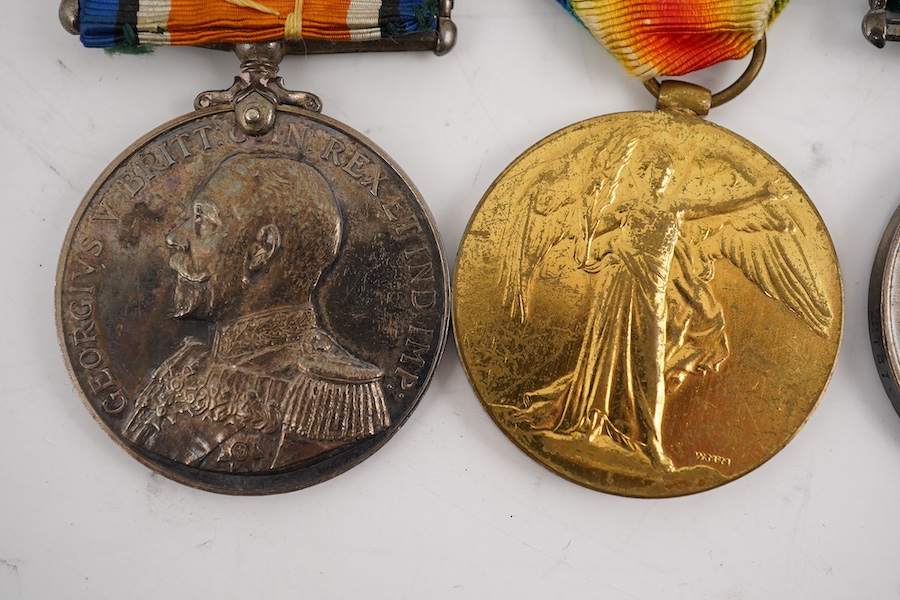 A First World War medal trio and Naval Reserve Long Service medal awarded to R.E.A. Lawrence ENGN RNR. Condition - fair.